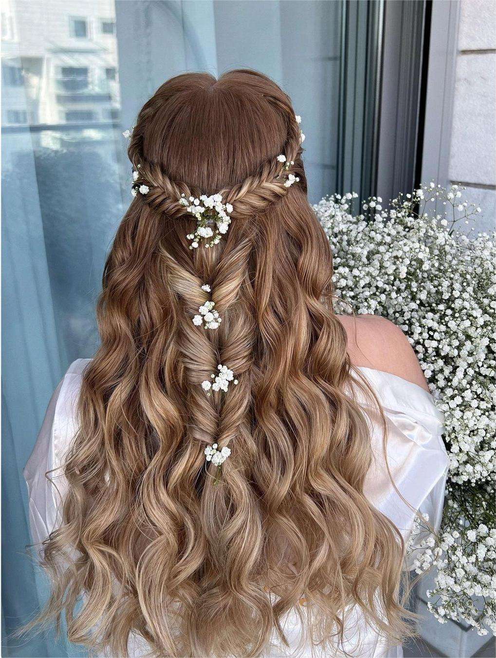 boho fishtail braided half up half down hairstyle via zhanna_syniavska
