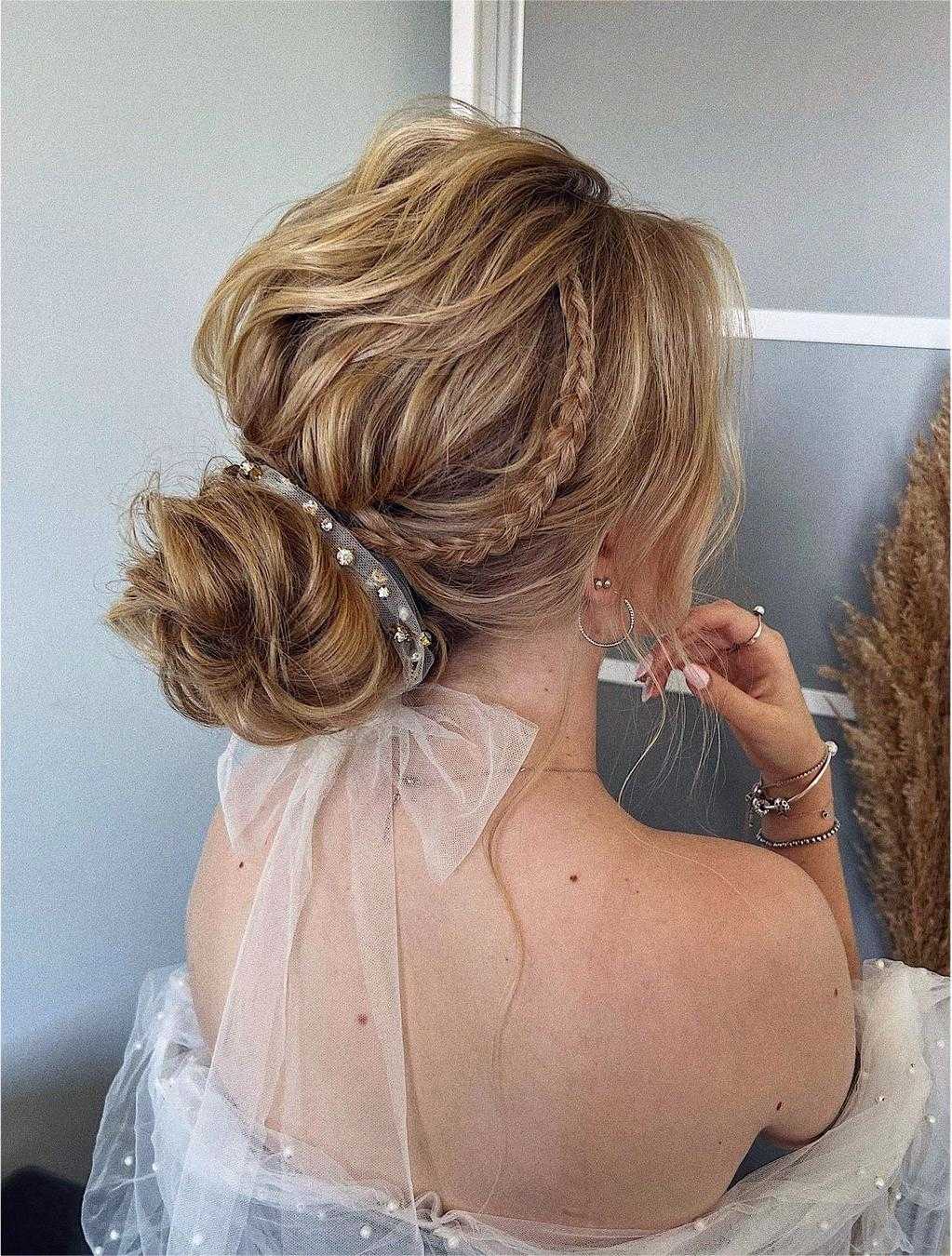 boho low bun wedding updo with bow via zhanna_syniavska