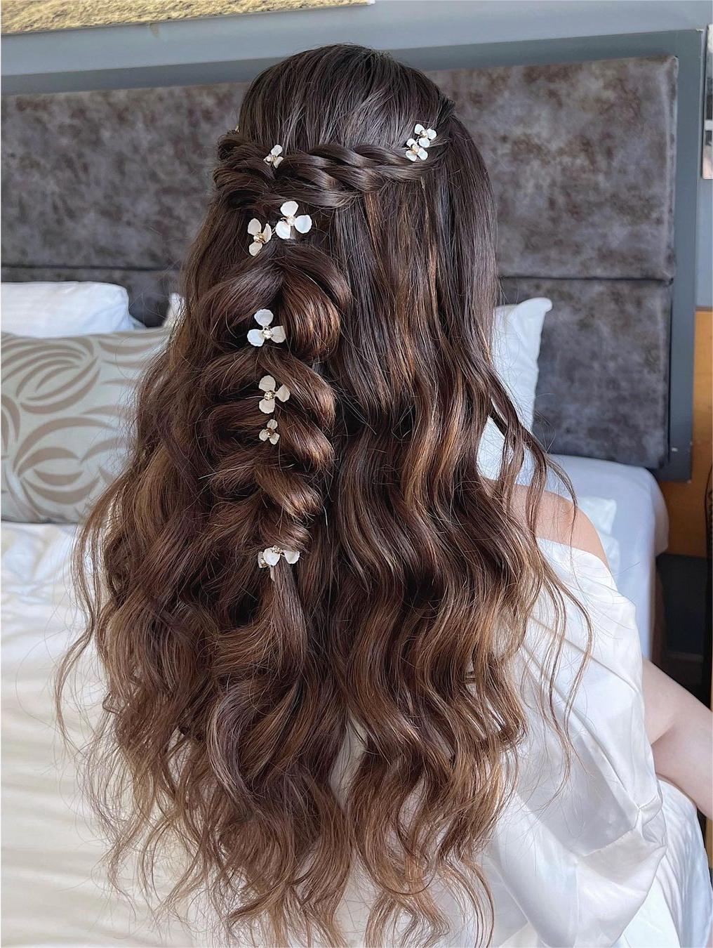 boho twisted braided half up half down hairstyle via zhanna_syniavska