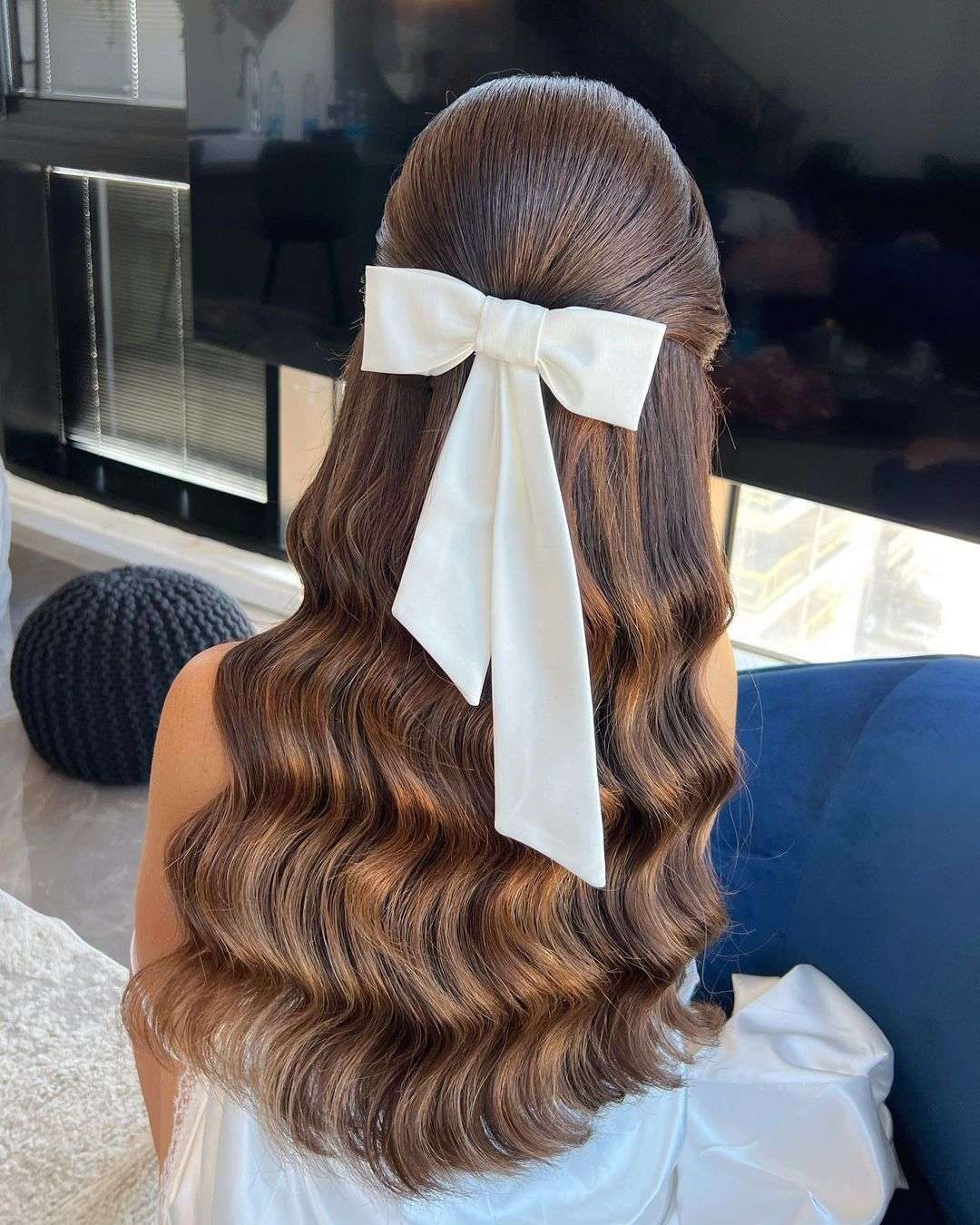 chic wavy half up half down hairstyle with bow via zhanna_syniavska