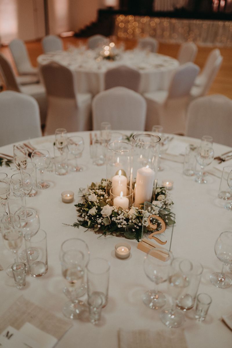 elegant greenery candle wedding centerpiece with gold mirror acrylic table number