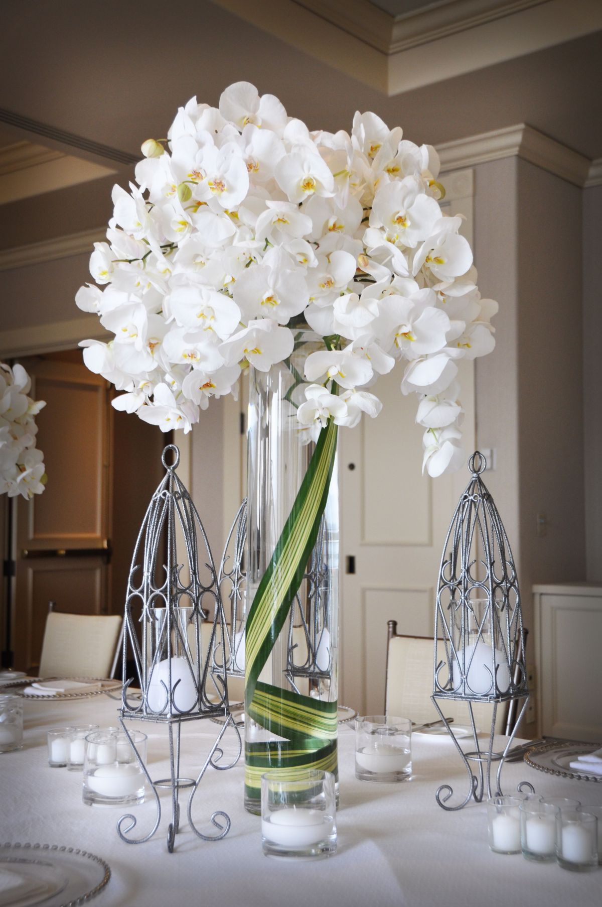 elegant tall orchid wedding centerpiece
