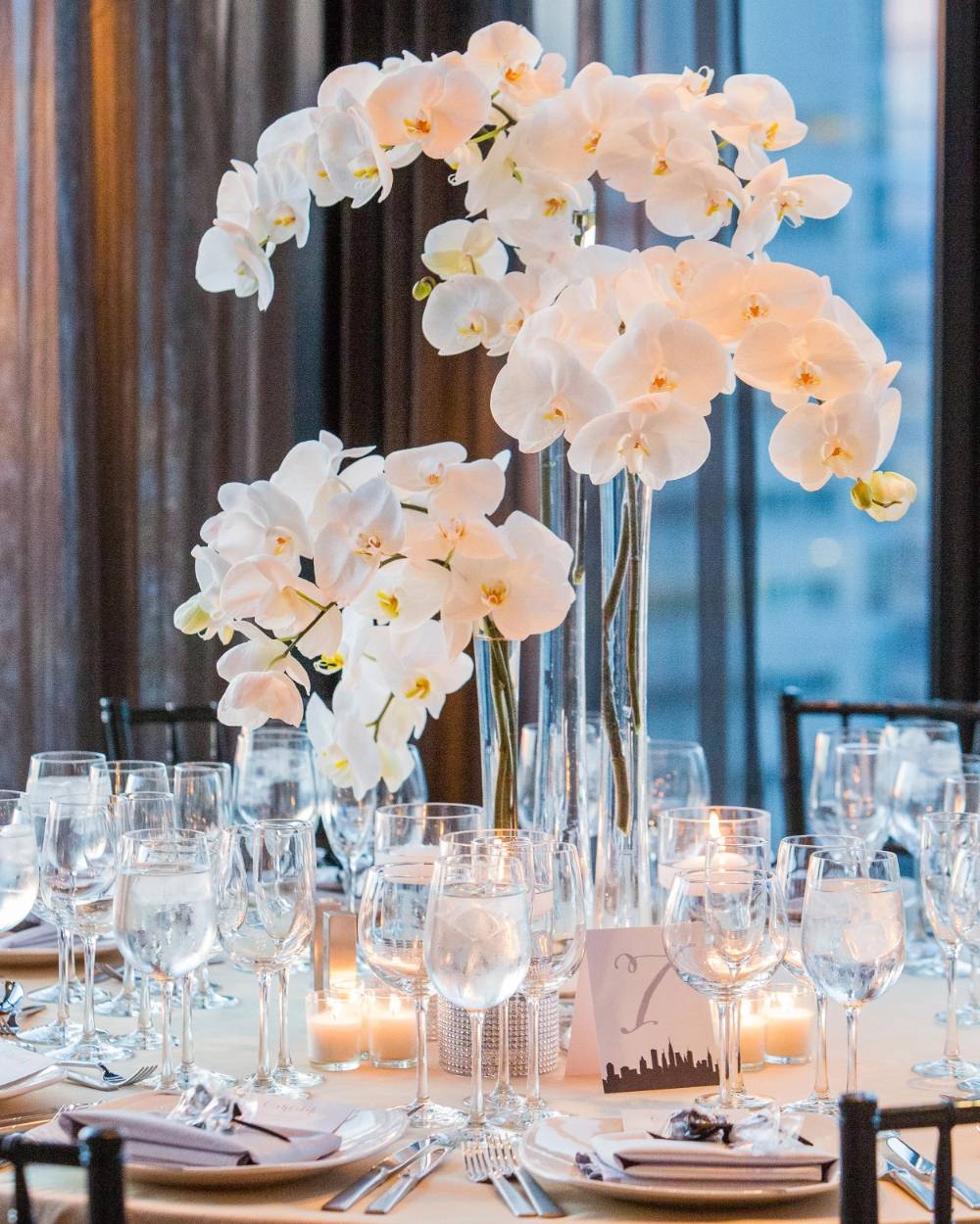 elegant tall white orchids wedding centerpiece