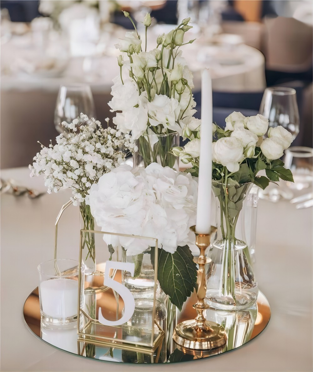 elegant white flowers and mirror wedding centerpiece