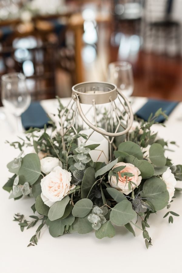 eucalyptus around lantern wedding centerpiece