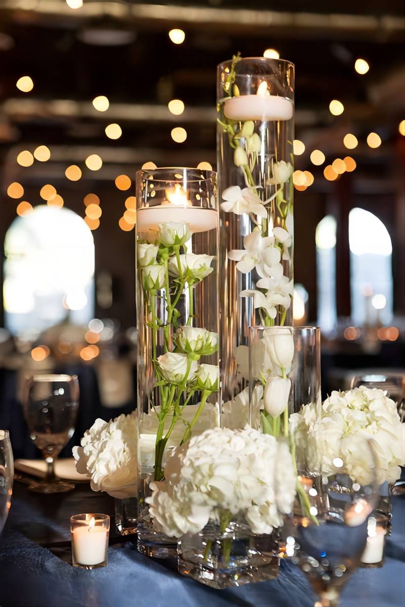 floating candles and white orchids roses wedding centerpiece with hydrangeas