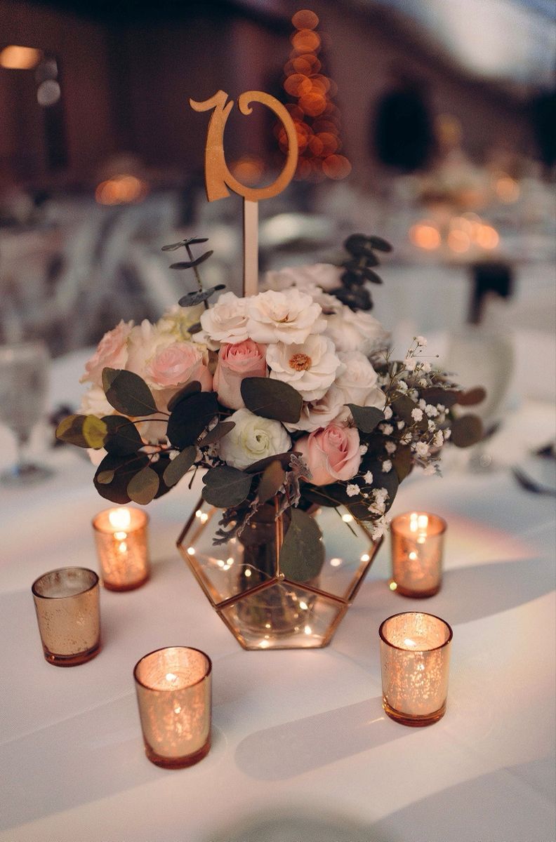 geometry with flowers and lights wedding centerpiece with wood table number