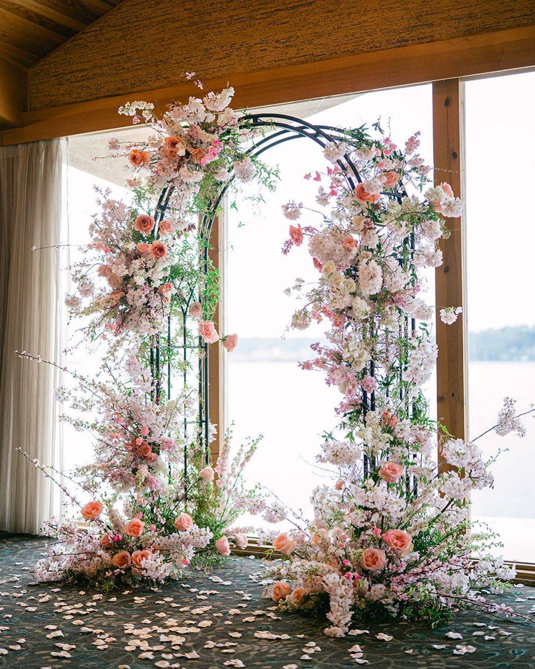 metal wedding arch with pink flowers via antherafloral