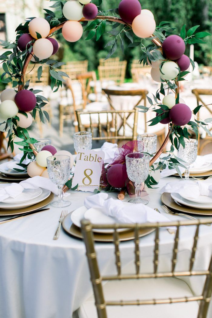 pink and burgundy balloon circle wedding centerpiece