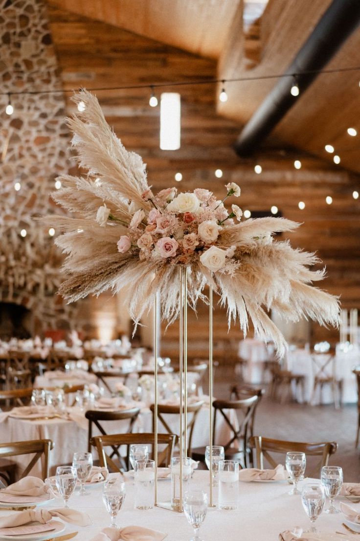 rustic bohemian tall pampas grass centerpiece for barn wedding round table