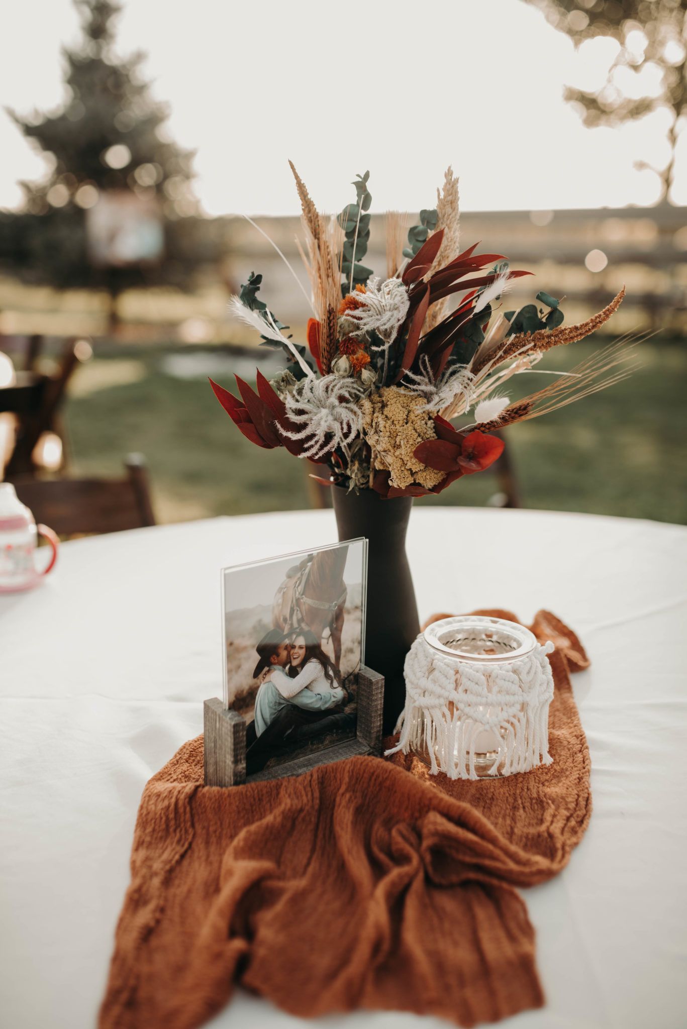 rustic fall bohemian wedding centerpiece with photo