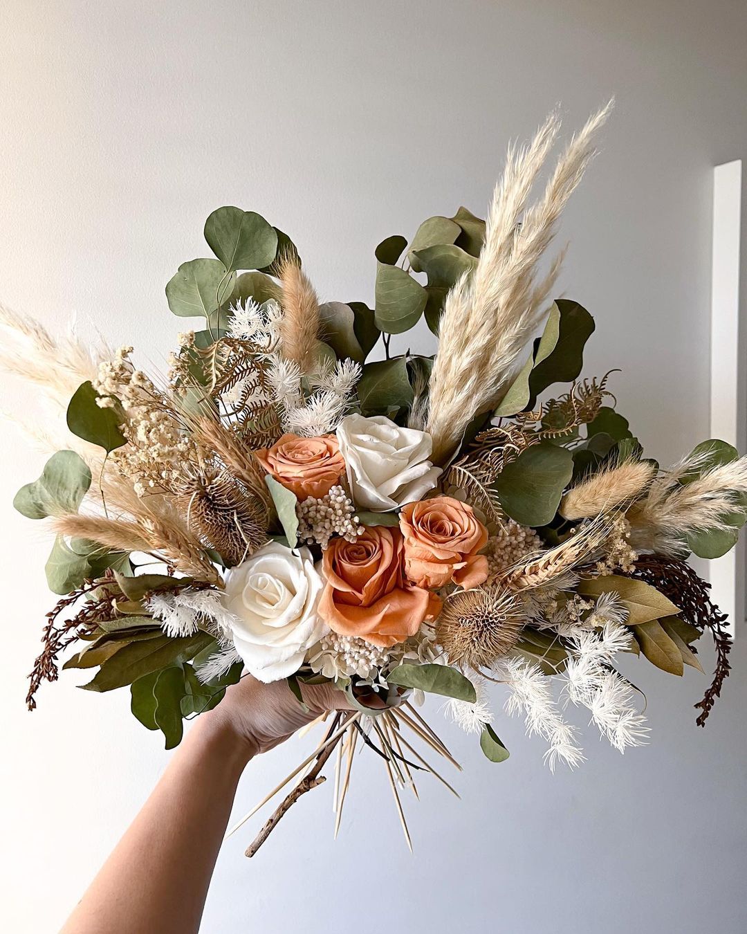 rustic sage and terracotta dried pampas grass eucalyptus roses wedding bouquet via leia.and.me