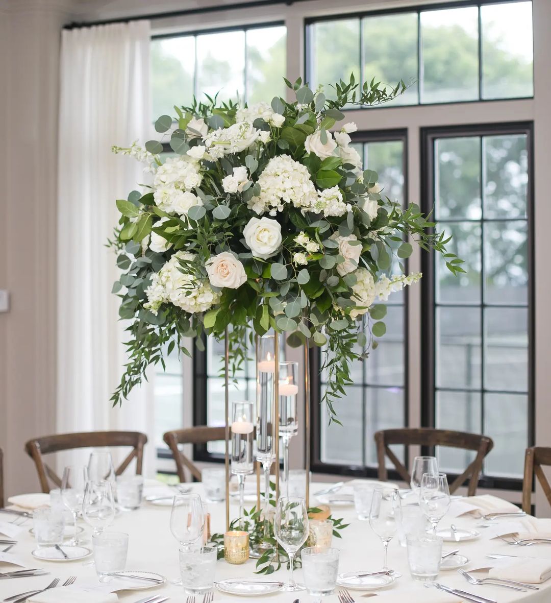 tall greenery and white flowers wedding centerp via flowersbykh