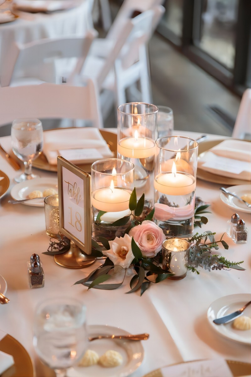 vintage blush floating candles and flowers wedding centerpiece for round table