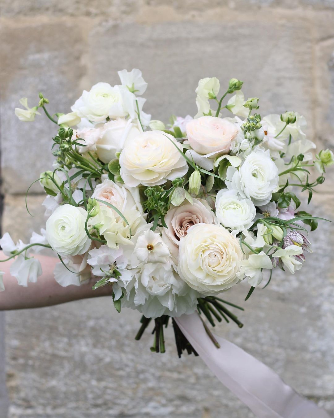 white ranunculus wedding bouquet via sarahharperflowers