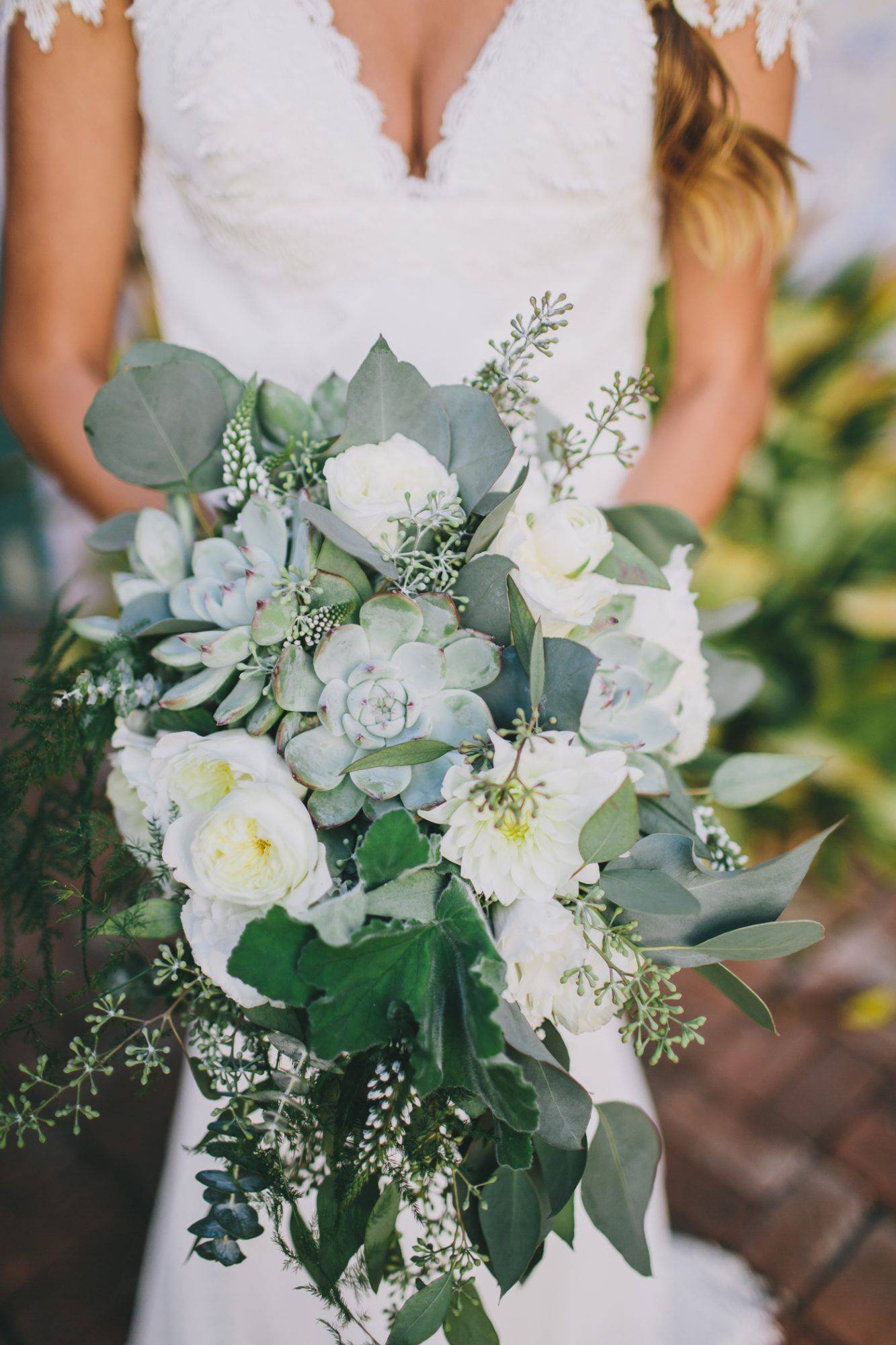 white roses and succulent wedding bouquet