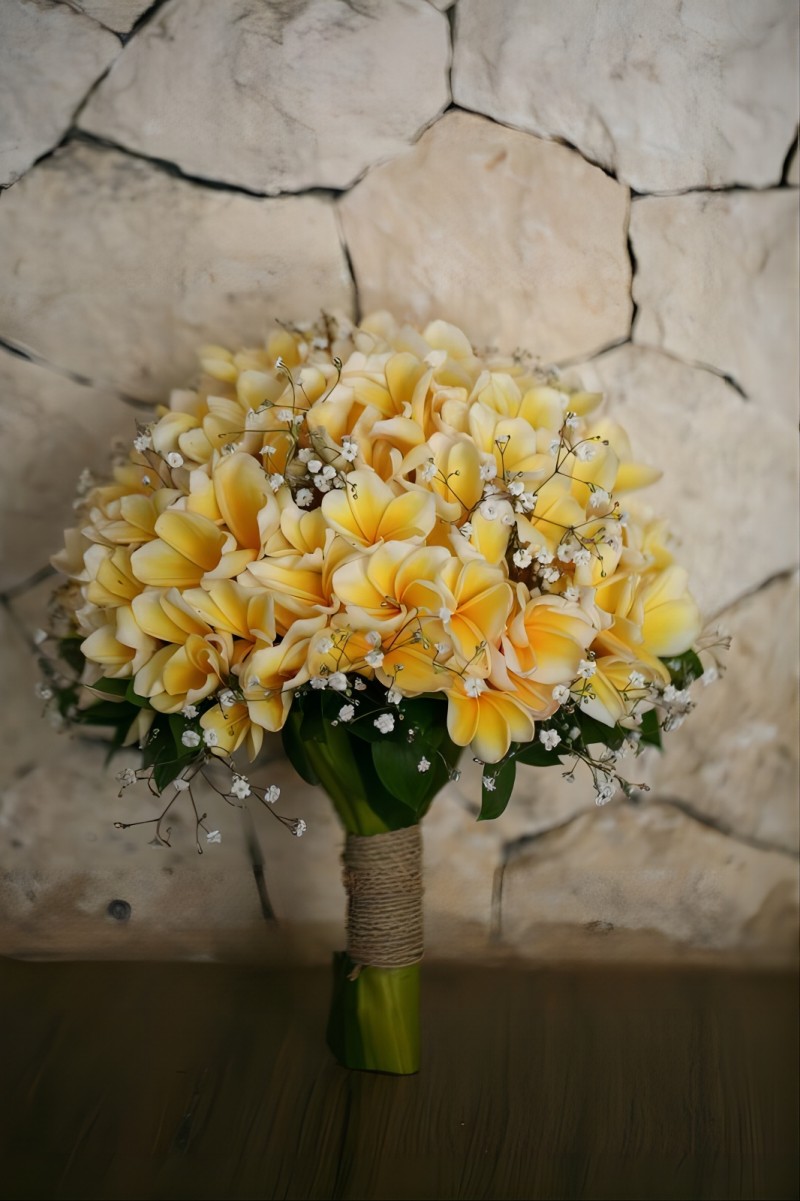 Plumeria and babys breath wedding bouquet