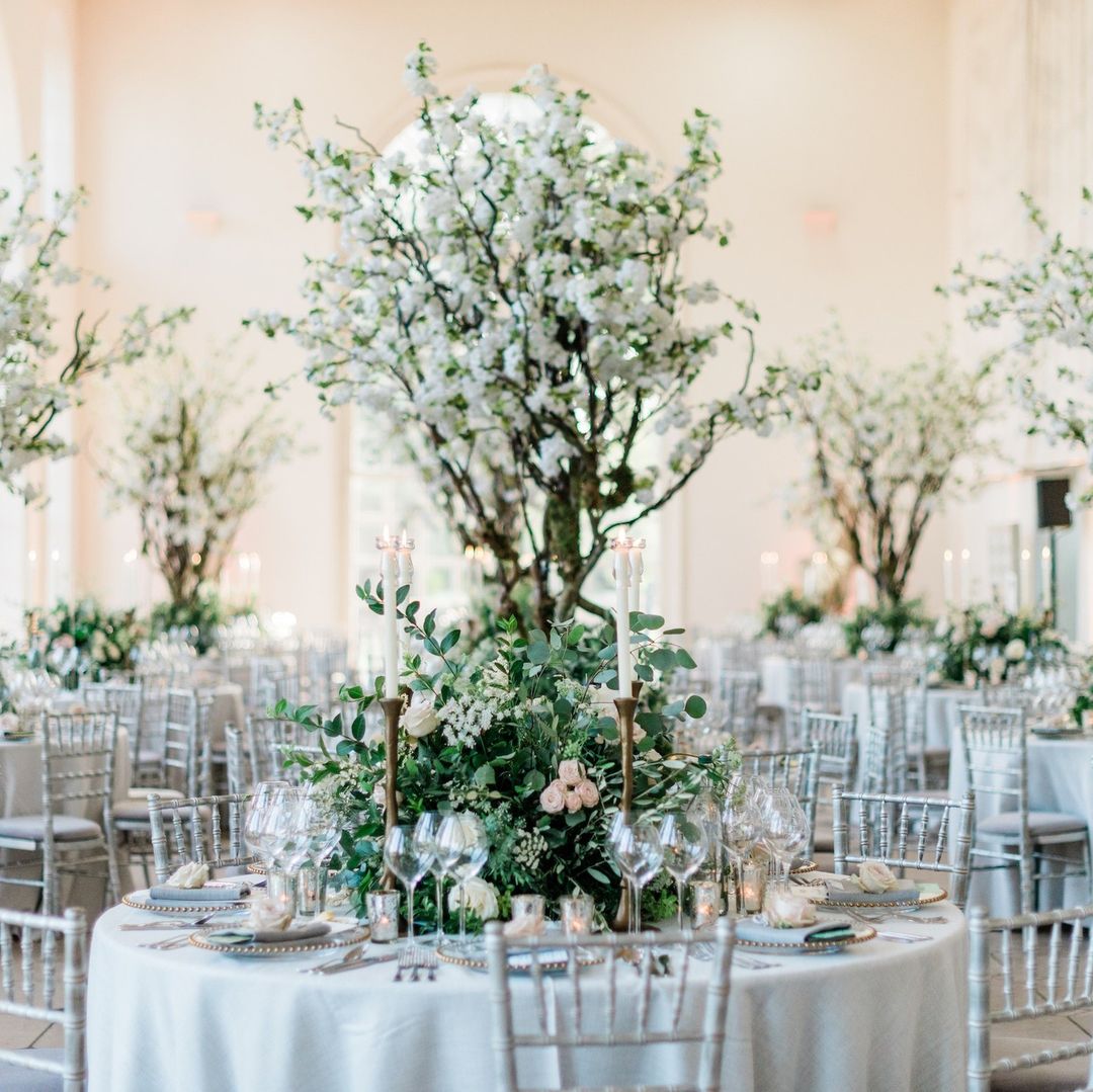 artificial cherry blossoms and tree wedding centerpiece for round table via larrywalshe