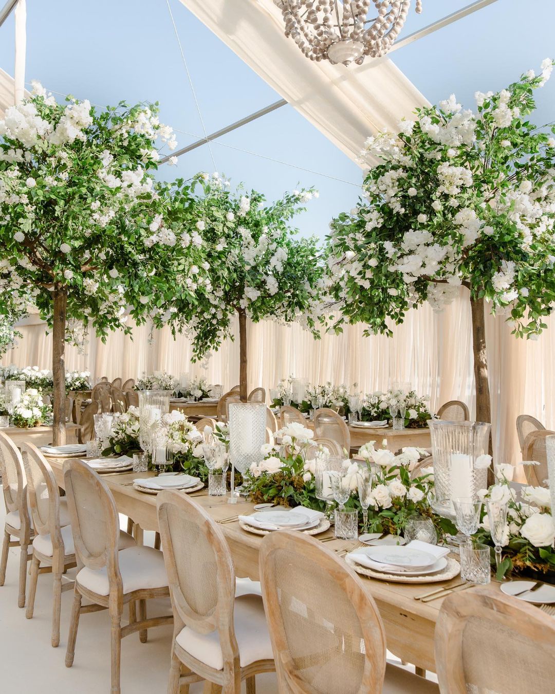 rustic tall artificial white flowers and tree wedding centerpiece