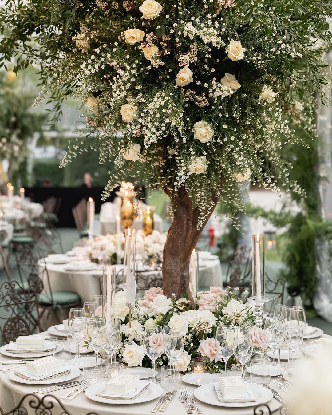 tall artificial flowers and tree wedding centerpiece